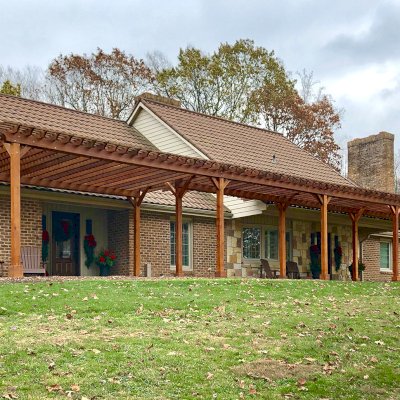 Traditional Wooden Garden Pergola (Options: 22' L x 14.5' W & 42' L x 8' W [Connected], Mature Redwood, No Electrical Wiring Trim, Open Roof with Slats at 18", Rafters at 18", Lengthwise Roof Support Timbers, 9-Post Anchor Kit for Stone, No Ceiling Fan Base, No Privacy Panels, No Curtain Rods, 9.5' Post Height, Transparent Premium Sealant). Photo Courtesy of K. Feliciani of Greensburg, Pennsylvania.