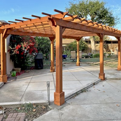 Traditional Wooden Garden Pergola (Options: 24' L x 14' W, California Redwood, No Electrical Wiring Trim, Open Roof with Slats at 18", Rafters at 18", 6-Post Anchor Kit for High-Wind, No Ceiling Fan Base, No Privacy Panels, No Curtain Rods, 10' Posts, Transparent Premium Sealant). Photo Courtesy of R. Pang of San Jose, CA.