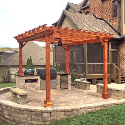 Traditional Wooden Garden Pergola (Options: 14' L x 12' W, California Redwood, Electrical Wiring Trim for 2 Posts, Open Roof with Slats at 12", Rafters at 18", 4-Post Anchor Kit for Concrete, 1 Ceiling Fan Base, No Privacy Panels, No Curtain Rods, Transparent Premium Sealant). Photo Courtesy of T. Wade of Clinton, TN.