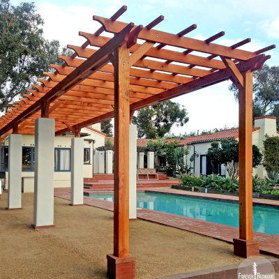 Traditional Wooden Garden Pergola (Options: 40' L x 9' W, Douglas-fir, No Electrical Wiring Trim, Open Roof with Slats at 18", Rafters at 18", Lengthwise Roof Support, 8-Post Anchor Kit for Stone, No Ceiling Fan Base, No Privacy Panels, No Curtain Rods, 9.5' Post Height, Transparent Premium Sealant). Photo Courtesy of Emilio E. of Malibu, CA.