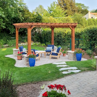 Traditional Wooden Garden Pergola (Options: 14' L x 14' W, California Redwood, No Electrical Wiring Trim, Open Roof with Slats at 12", Rafters at 18", 4-Post Anchor Kit for Concrete, No Ceiling Fan Base, No Privacy Panels, 1 Curtain Rod, 9' Posts, Transparent Premium Sealant). With 8x8's Posts Instead of the Standard 6x6's by Custom Request. Photo Courtesy of G. Neal of Northbrook, IL.