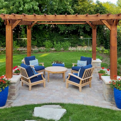 Traditional Wooden Garden Pergola (Options: 14' L x 14' W, California Redwood, No Electrical Wiring Trim, Open Roof with Slats at 12", Rafters at 18", 4-Post Anchor Kit for Concrete, No Ceiling Fan Base, No Privacy Panels, 1 Curtain Rod, 9' Posts, Transparent Premium Sealant). With 8x8's Posts Instead of the Standard 6x6's by Custom Request. Photo Courtesy of G. Neal of Northbrook, IL.