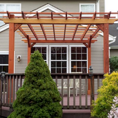 Traditional Wooden Garden Pergola (Options: 15' L x 12' W, California Redwood, No Electrical Wiring Trim, Open Roof with Slats at 18", Rafters at 18", Widthwise Roof Support Timbers, 4- Post Anchor Kit for Wood, No ceiling Fan Base, No Privacy Panels, No Curtain Rods, 9' Post Height, Transparent Premium Sealant). Photo Courtesy of Ian Clarke of Allentown, NJ.