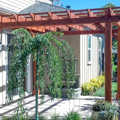 Traditional Wooden Garden Pergola (Options: 12' L x 12' W, Mature Redwood, Electrical Wiring Trim for 1 Post, Open Roof with Slats at 18", Rafters at 18", 4-post kit for Stone, Brick, or Concrete, No Ceilin Fan Base, No Privacy Panels, No Curtain Rods, 8.5' Post Height, Transparent Premium Sealant).