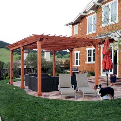 Traditional Wooden Garden Pergola (Options: 22' L x 14' W, Mature Redwood, Electrical Wiring Trim for 2 Posts, Open Roof with Slats at 6", Rafters at 18", Widthwise Roof Support Timbers, 6-Post Anchor Kit for Concrete, No Ceiling Fan Base, No Privacy Panels, No Curtain Rods, 9.5' Post Height, Transparent Premium Sealant). Photo Courtesy of Roger Cassidy of Novato, CA.