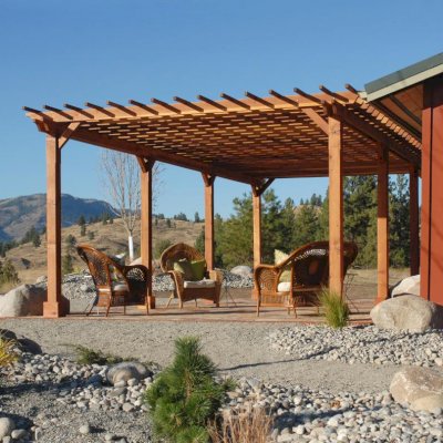 Traditional Wooden Garden Pergola (Options: 30' L x 16' W, Mature Redwood, No Electrica Wiring Trim Kit, Slats at 12" and Rafters at 18", Lengthwise Roof Support Timbers, 6-Post Anchor Kit for Concrete, No Ceiling Fan Base, No Privacy Panels, No Curtain Rods, 9' Post Height, Transparent Premium Sealant, Custom: 2 extra post). Photo Courtesy of Mr. Craig Lawrence of Renton, WA.
