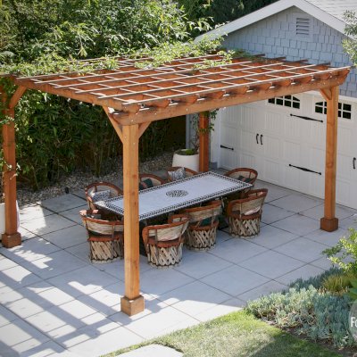 Traditional Wooden Garden Pergola (Options: 15' L x 12' W, Douglas-fir, Electrical Wiring Trim for 1 Post, Open Roof with Slats at 18", Rafters at 18", 4-Post Anchor Kit for Concrete, 1 Ceiling Fan Base, No Privacy Panels, No Curtain Rods, 9' Post Height, Transparent Premium Sealant). Structure has been up for nearly 2 years when these photos were taken.Photo Courtesy of L. Martling of Los Angeles, CA.