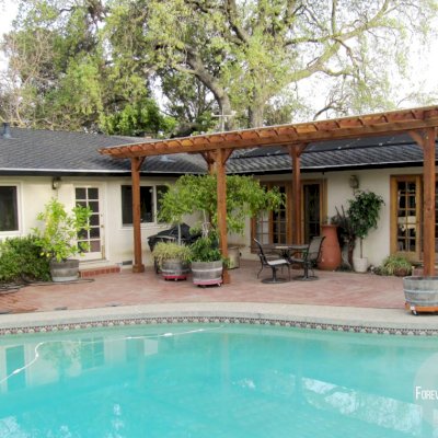 Traditional Wooden Garden Pergola (Options: 32' L x 14' W, Mature Redwood, No Electrical Wiring Trim, Slats at 12", Rafters at 18", Lengthwise Roof Support Timbers, 6-Post Anchor Kit for Stone, No Ceiling Fan Base, No Privacy Panels, No Curtain Rods, 9' Post Height, Transparent Premium Sealant). Slight Incline by Custom Request, If you'd like a "waterproof pergola" we can help with a slight incline in the roof design.