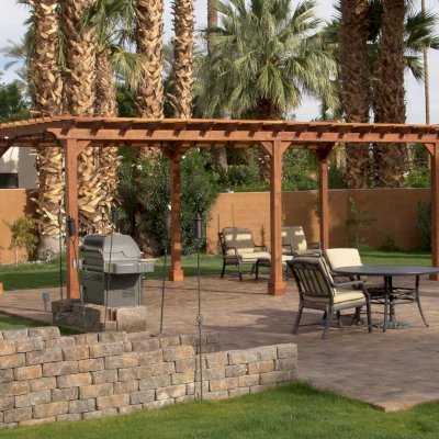 Traditional Wooden Garden Pergola (Options: 26' L x 14' W, California Redwood, No Electrical Wiring Trim, Open Roof with Slats at 12", Rafters at 18", Lengthwise Roof Support Timbers, 6-Post Anchor Kit for Stone, No Ceiling Fan Base, No Privacy Panels, No Curtain Rods, 9' Post Height, Transparent Premium Sealant). Photo Courtesy of Val Kay of Indian Wells, CA.