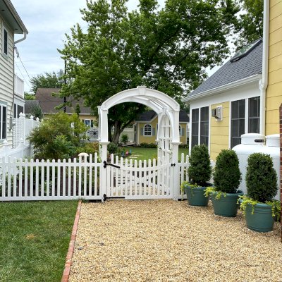 Custom Versailles Arbor (Options: 60" W x 60" D, Douglas-fir, 8' H, Custom Stain) with Custom Fence and Door. Photo Courtesy of Jessica and Brian Steel of Leesburg, Maryland.