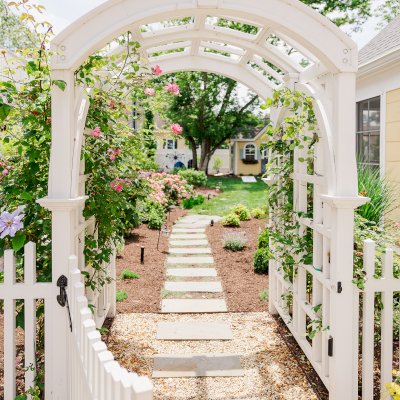 Custom Versailles Arbor (Options: 60" W x 60" D, Douglas-fir, 8' H, Custom Stain) with Custom Fence and Door. Photo Courtesy of Jessica and Brian Steel of Leesburg, Maryland.