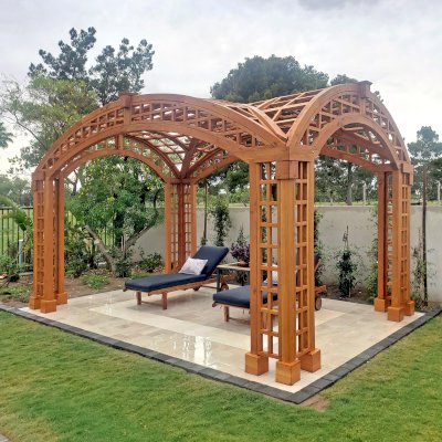 Victorian Arch Trellis Pergola (Options: 16' L x 10' W, Douglas-fir, Post Anchor Kit for Concrete, No Rain Guard, Transparent Premium Sealant). Photo Courtesy of B. Rowlison of Martinez Lake, AZ.