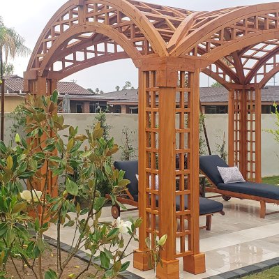 Victorian Arch Trellis Pergola (Options: 16' L x 10' W, Douglas-fir, Post Anchor Kit for Concrete, No Rain Guard, Transparent Premium Sealant). Photo Courtesy of B. Rowlison of Martinez Lake, AZ.