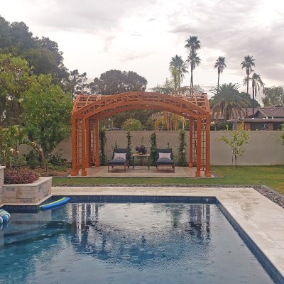 Victorian Arch Trellis Pergola (Options: 16' L x 10' W, Douglas-fir, Post Anchor Kit for Concrete, No Rain Guard, Transparent Premium Sealant). Photo Courtesy of B. Rowlison of Martinez Lake, AZ.