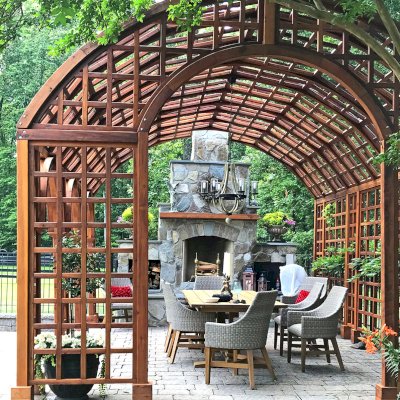 The Victorian Trellis (Options: 22' L x 14' W, Combination of Arcs and Lattice Panels, Mature Redwood, No Rain Guard, 9' Post Height, No Electrical Wiring Trim, Post Anchor Kit for Stone, No Ceiling Fan Base, Transparent Premium Sealant). Photo Courtesy of JR and Trish West of King George, Virginia.