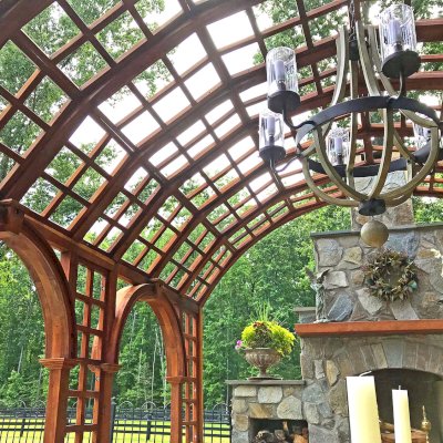 The Victorian Trellis (Options: 22' L x 14' W, Combination of Arcs and Lattice Panels, Mature Redwood, No Rain Guard, 9' Post Height, No Electrical Wiring Trim, Post Anchor Kit for Stone, No Ceiling Fan Base, Transparent Premium Sealant). Photo Courtesy of JR and Trish West of King George, Virginia.