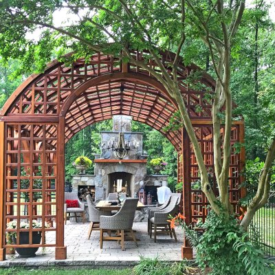 The Victorian Trellis (Options: 22' L x 14' W, Combination of Arcs and Lattice Panels, Mature Redwood, No Rain Guard, 9' Post Height, No Electrical Wiring Trim, Post Anchor Kit for Stone, No Ceiling Fan Base, Transparent Premium Sealant). Photo Courtesy of JR and Trish West of King George, Virginia.
