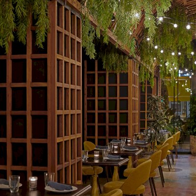 Custom Victorian Trellis (Options: California Redwood, Transparent Premium Sealant). Installed at restaurant ALLAVITA in 564 W Randolph St, Chicago, IL. Design By Kehoe Designs, Photographer: Anthony Tahlier.
