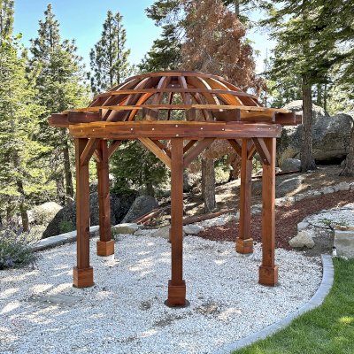 Wooden Dome Pergola (Options: 12' Diameter, Without Deck, California Redwood, Open Roof with Slats at 18", 7.5' Posts, 1 Electrical Wiring Trim, 6-Post Anchor Kit for Concrete, Transparent Premium Sealant). Photo Courtesy of G. Stratton of Stateline, NV.