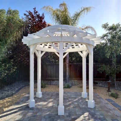 Wooden Dome Pergola (Options: 12' Diameter, No Deck, Douglas-fir, Open Roof with Slats at 6", 9' Posts, No Electrical Wiring Trim, 6-Post Anchor Kit for Concrete, Off-White Oil-Based Primer). Photo Courtesy of J. McPeak of San Jose, CA.