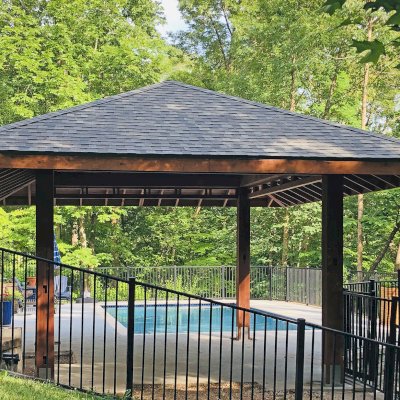 Custom Zen Garden Pavilion (Options: 26ft x 22ft, No Deck & Railings, Mature Redwood, 11' H Posts, with Square 10 x 10 Posts Instead of Rounded, 4 Electrical Wiring Trims, 4 Post High-Wind Anchor Kit, 2 Ceiling Fan Bases, No Curtain Rods, Transparent Premium Sealant). Photo Courtesy of P. Gmerek of Wildwood, Missouri.