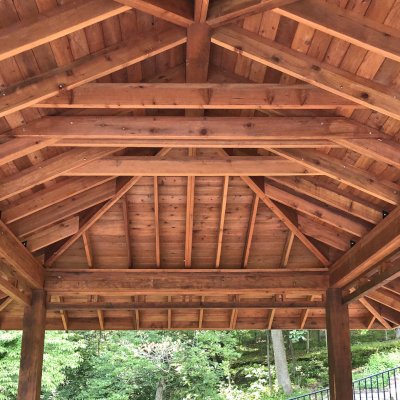 Custom Zen Garden Pavilion (Options: 26ft x 22ft, No Deck & Railings, Mature Redwood, 11' H Posts, with Square 10 x 10 Posts Instead of Rounded, 4 Electrical Wiring Trims, 4 Post High-Wind Anchor Kit, 2 Ceiling Fan Bases, No Curtain Rods, Transparent Premium Sealant). Photo Courtesy of P. Gmerek of Wildwood, Missouri.