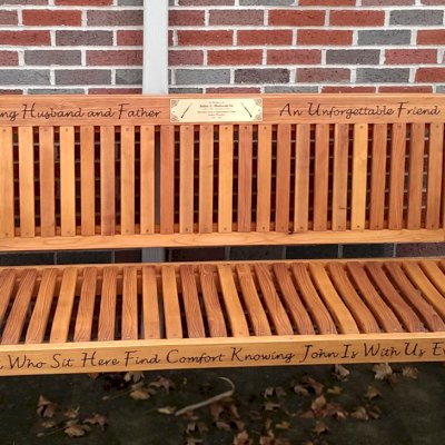 Ti Amo Benches (Options: 6 ft, Mature Redwood, No Cushion, Custom Engraving, Custom Plaque Provided by Customer, Transparent Premium Sealant). This customer photo shows how you can combine using our Engraving option with a Plaque that you can have made locally or via our Engraving partner in Santa Rosa, CA, Jay's Engraving.