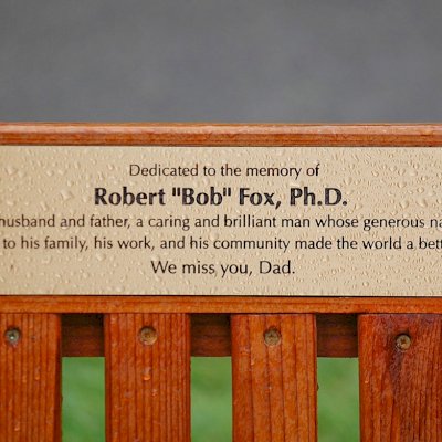In Memory of Bob Fox. Ti Amo Benches (Options: 6 ft, Mature Redwood, No Cushion, No Engraving, Custom Plaque Provided by Customer, Transparent Premium Sealant). Photo Courtesy of Fox Family.