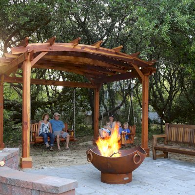Ti Amo Benches (Options: 6 ft, California Redwood, No Cushion, No Engraving, Transparent Premium Sealant). Photo Also Shows an Arched Pergola with Bench Swing Seats. Photo Courtesy of Tom Marten of Kitty Hawk, North Carolina.