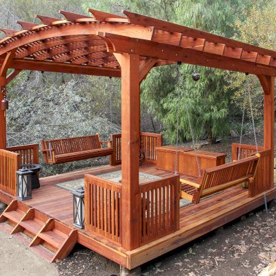 Traditional Wooden Storage Bench (Options: 79 1/2 L x 24 W x 24 H inches, Redwood, Split Seat, Add Pistons, No Engraving, Transparent Premium Sealant). Photo Also Shows a Bench Swing Seat Attached to an Arched Pergola with Deck and Custom Rails. Photo Courtesy of Bob P. of Westlake Village, CA. 
