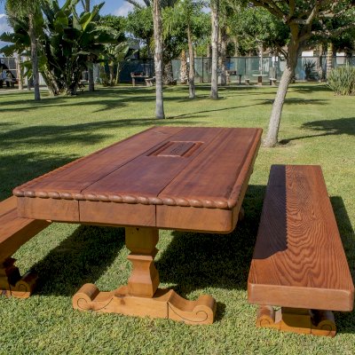 Trestle Natural Wood Outdoor Table (Custom designed trestle designed table in Old-Growth Redwood with massive timbers and custom carving and engraving.)