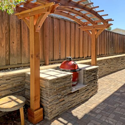 Two-Post Arched Wood Arbor (Options: 10' x 4', California Redwood, 6" x 6" Posts and 2" x 6" Roof Timbers, 6" Overhang Instead of the Standard 12", 7.5ft H Posts, 2-Post anchor Kit for High-Wind, No Privacy Panel, Transparent Premium Sealant). Photo Courtesy of B. Elliott of Concord, CA.