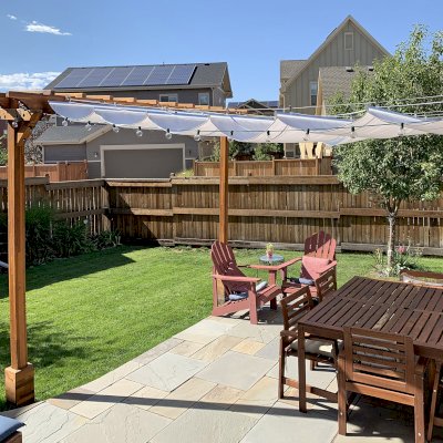 Two-Post Wood Arbor (Options: 12' x 2', Mosaic Redwood, No Privacy Panel, 9.5 ft Posts Height, 2-Post Anchor Kit for High-Wind, Transparent Premium Sealant). Retractable Shade Canopy was purchased from Infinity Canopy of Los Angeles, CA, www.infinitycanopy.com. Photo Courtesy of D. Kasper of Denver, Colorado. 
