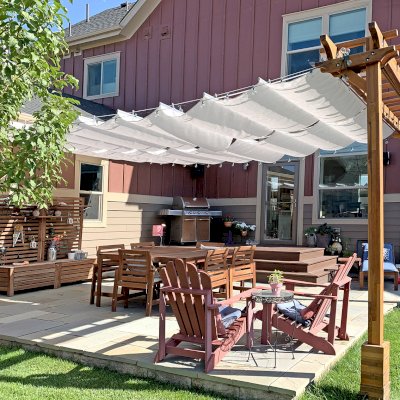 Two-Post Wood Arbor (Options: 12' x 2', Mosaic Redwood, No Privacy Panel, 9.5 ft Posts Height, 2-Post Anchor Kit for High-Wind, Transparent Premium Sealant). Retractable Shade Canopy was purchased from Infinity Canopy of Los Angeles, CA, www.infinitycanopy.com. Photo Courtesy of D. Kasper of Denver, Colorado. 