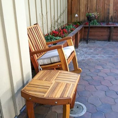 Vera's Custom Wood Side Table (Options: 21 ½", Redwood, 18" H, Transparent Premium Sealant) with a Ruth Rocking Chair. Photo Courtesy of Julie Joyce of Cupertino, CA.