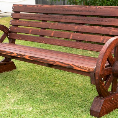 Wagon Wheel Wooden Bench (Options. 6 ft, Mature Redwood (20-yr Warranty) , No Cushion, Custom Engraving - 51-100 chars, Cherry Stain Premium Sealant).