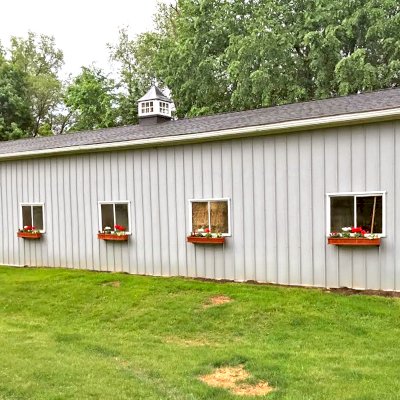 Window Box Planters (Options: 48" L, 7 1/2" W, 7 1/2" H, Redwood, Add Steel Hangers, No Railing Strips, Transparent Premium Sealant). Photo Courtesy of L. Piette of Oxford, Michigan.
