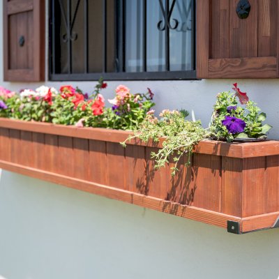Window Box Planters (Options: 84" L, 9" W, 10.5" H, Standard Base, Mosaic Douglas, with Steel Hangers, No Railing Strips, No Growing Vegetables, Coffee Stain Premium Sealant). Photo Also Shows 2 Shutters.